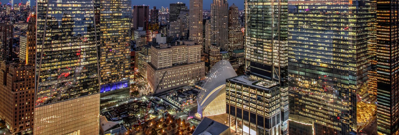 A view of One World Trade Center, the Oculus, Three World Trade Center, and Four World Trade Center at night